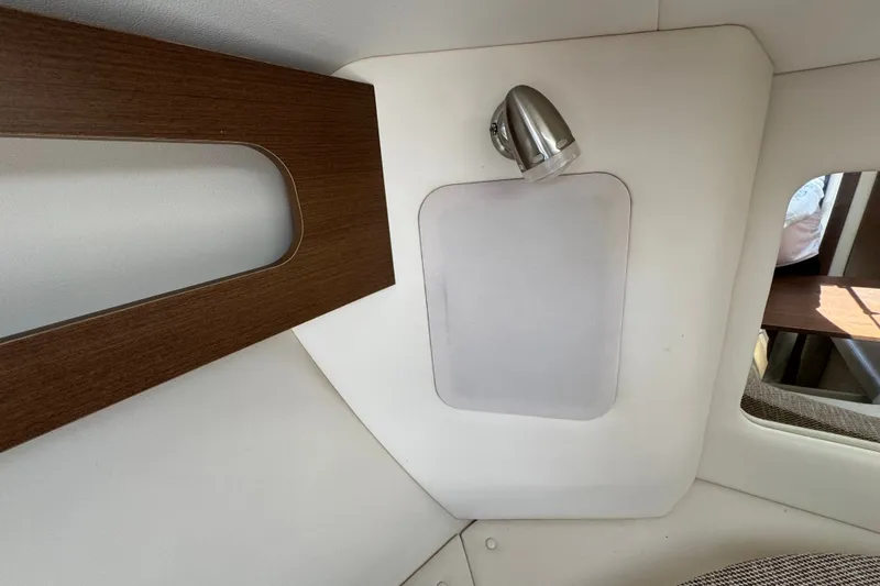 Slide: The Image of Interior cabin of 2018 Sea Ray Sundancer 260 with modern light fixture. - 52