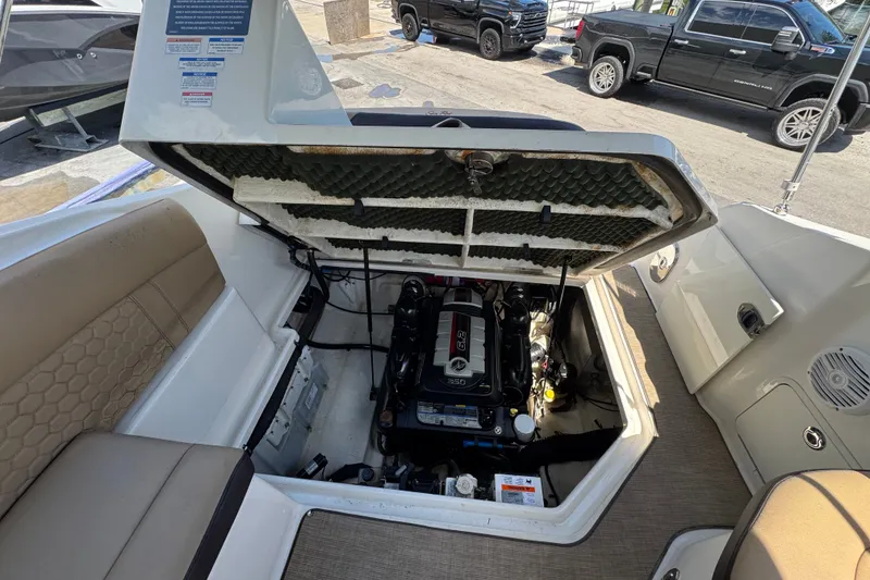 Slide: The Image of Open engine compartment of 2018 Sea Ray Sundancer 260 boat, showcasing engine details. - 58