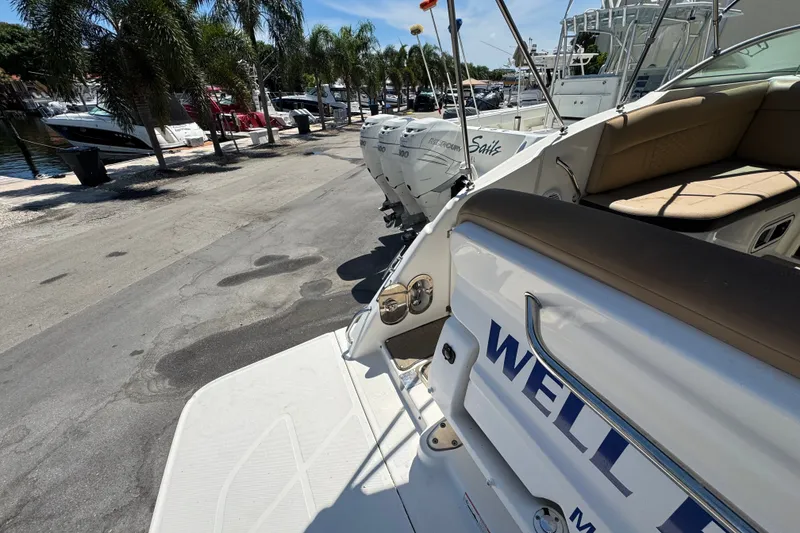 Slide: The Image of 2018 Sea Ray Sundancer 260 docked, showcasing sleek design and comfortable seating. - 18