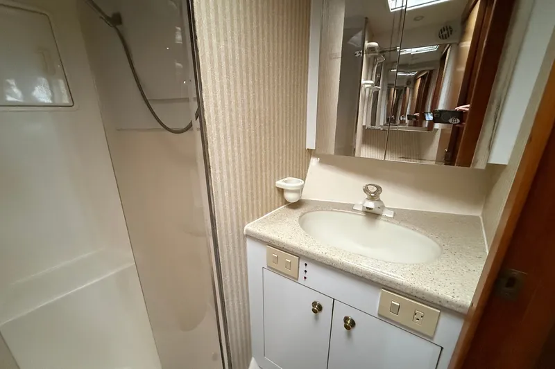 Slide: The Image of Bathroom interior of 2003 Ocean Yachts 43 Super Sport with shower and vanity. - 23