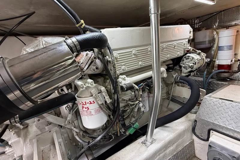 Slide: The Image of Engine room of 2003 Ocean Yachts 43 Super Sport, showcasing detailed machinery components. - 9