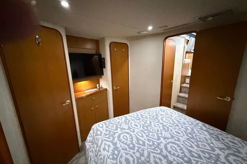 Slide: The Image of Interior of 2003 Ocean Yachts 43 Super Sport with cozy bedroom and TV. - 22