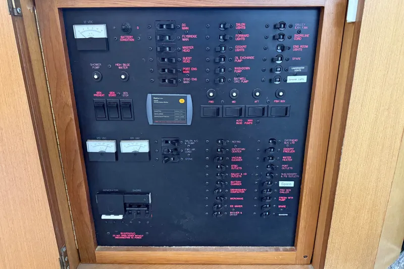 Slide: The Image of Electrical control panel of a 2003 Ocean Yachts 43 Super Sport boat. - 24