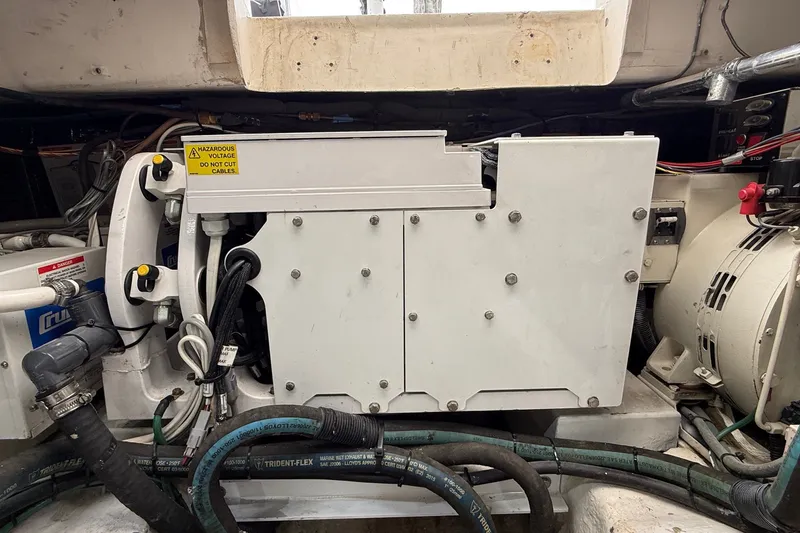 Slide: The Image of Engine room of 2003 Ocean Yachts 43 Super Sport with electrical components and wiring. - 26