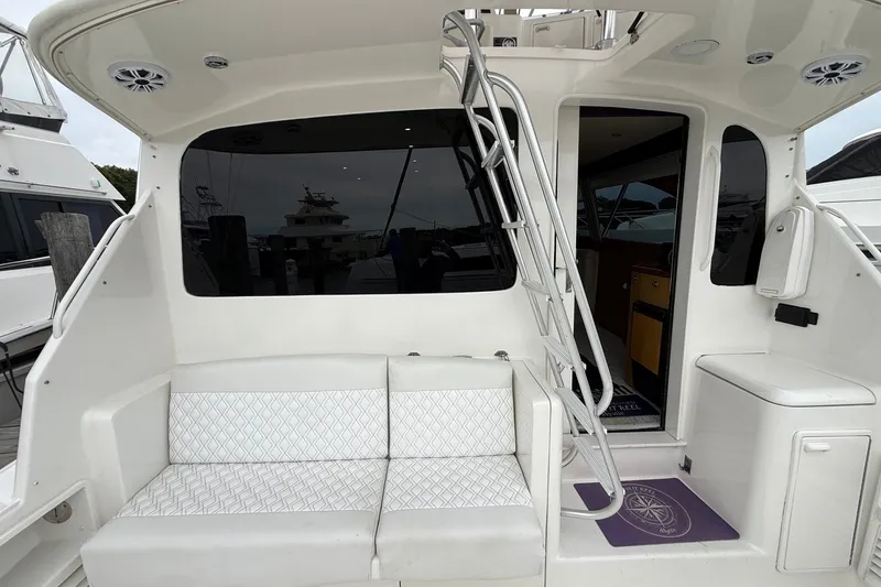 Slide: The Image of 2003 Ocean Yachts 43 Super Sport yacht interior with seating and ladder. - 5