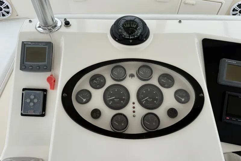Slide: The Image of Dashboard of 2003 Ocean Yachts 43 Super Sport with gauges and navigation instruments. - 11