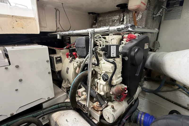 Slide: The Image of Engine room of 2003 Ocean Yachts 43 Super Sport, showcasing mechanical components. - 30