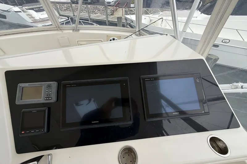 Slide: The Image of Control panel of a 2003 Ocean Yachts 43 Super Sport with navigation screens. - 10