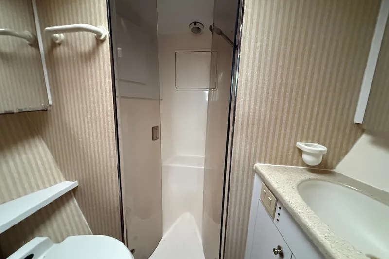 Slide: The Image of Bathroom interior of 2003 Ocean Yachts 43 Super Sport with shower and sink. - 25