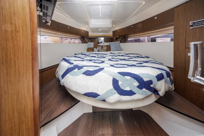 Slide: The Image of Luxurious cabin interior of 2020 Jeanneau NC 1095 with cozy bedding. - 31