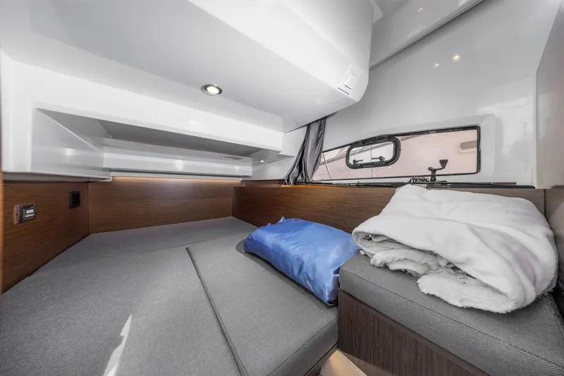 Slide: The Image of Cozy cabin interior of 2020 Jeanneau NC 1095 boat with modern furnishings. - 26