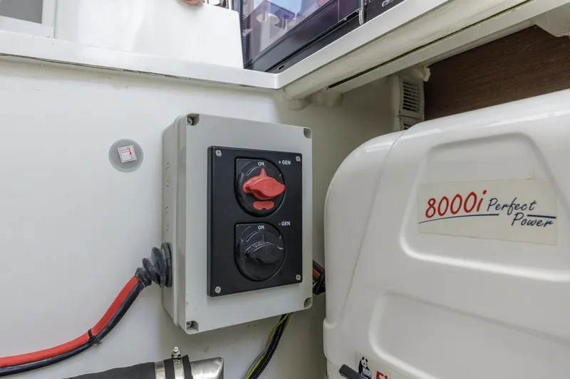 Slide: The Image of Electrical panel and power unit on 2020 Jeanneau NC 1095 boat. - 38