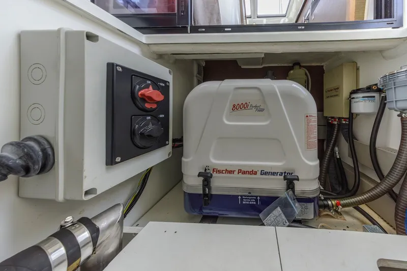Slide: The Image of Engine room of 2020 Jeanneau NC 1095 with Fischer Panda generator and control panel. - 37