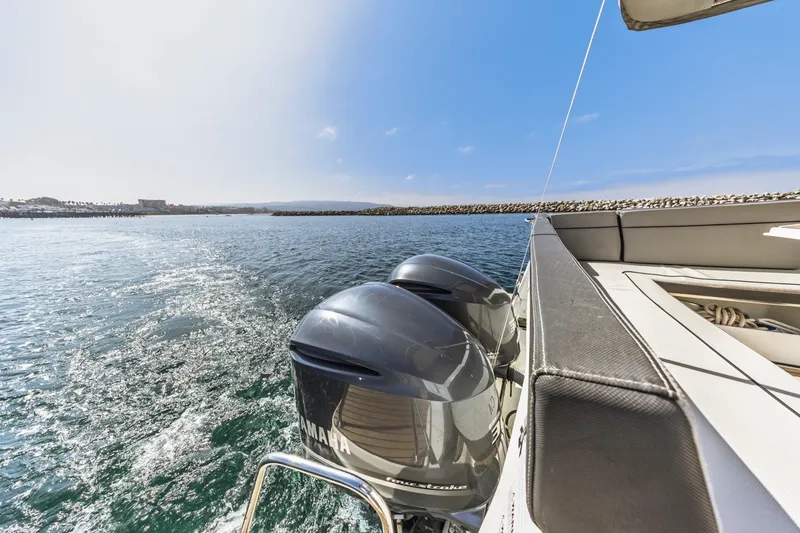 Slide: The Image of 2020 Jeanneau NC 1095 boat with Yamaha outboard engines on open water. - 15