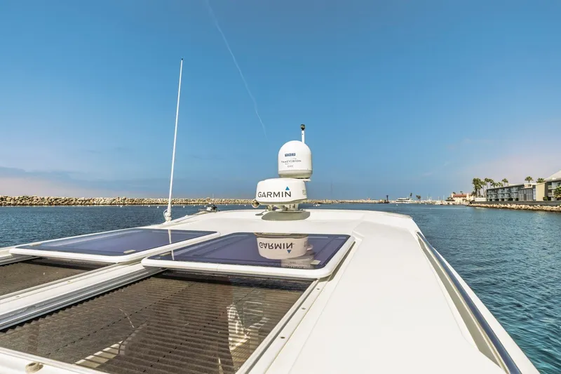 Slide: The Image of 2020 Jeanneau NC 1095 boat with Garmin equipment on calm water under clear sky. - 20