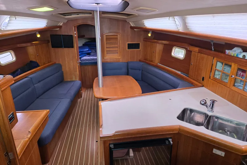 Slide: The Image of Interior of 2006 Hunter 36 sailboat with cozy seating and modern kitchen area. - 3