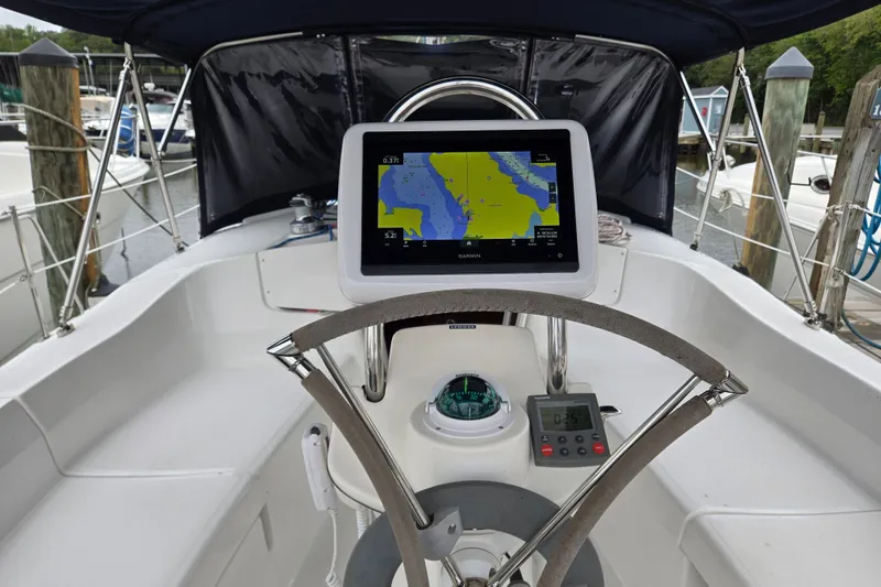 Slide: The Image of Steering wheel and navigation system on a 2006 Hunter 36 sailboat cockpit. - 40