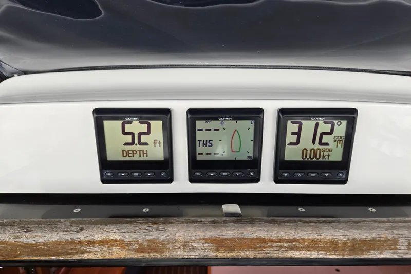 Slide: The Image of Garmin marine instruments on a 2006 Hunter 36 sailboat dashboard display depth and navigation data. - 43