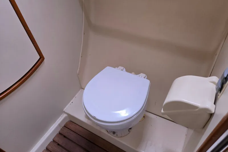 Slide: The Image of Compact marine toilet in 2006 Hunter 36 sailboat bathroom. - 36