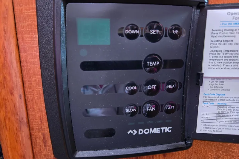 Slide: The Image of Dometic control panel in a 2006 Hunter 36 boat, featuring temperature and fan settings. - 22
