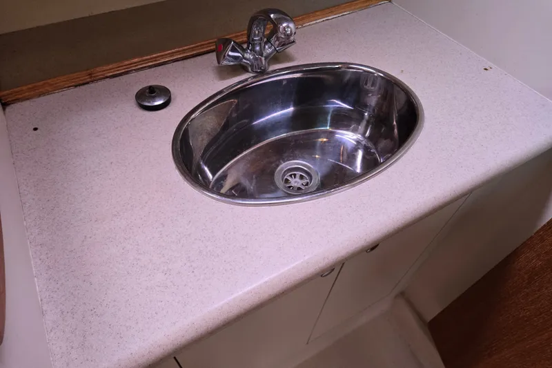 Slide: The Image of Stainless steel sink in 2006 Hunter 36 yacht bathroom. - 38