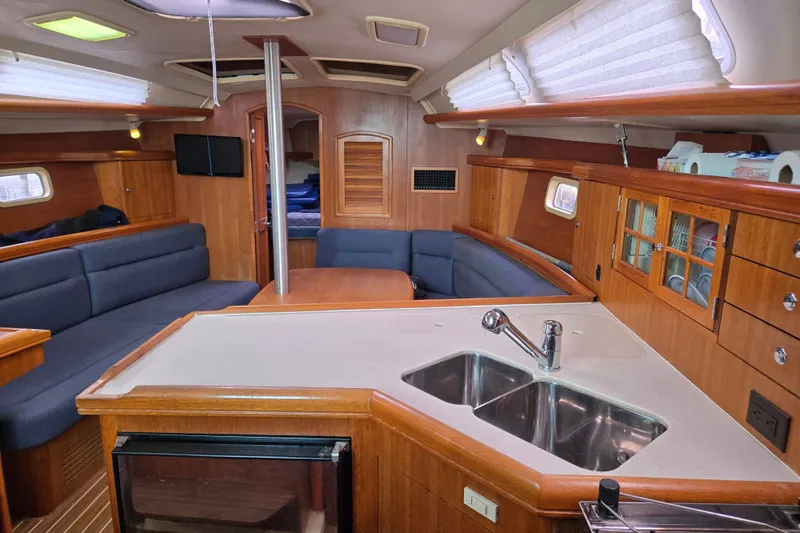 Slide: The Image of Interior of a 2006 Hunter 36 sailboat with wood finish and modern amenities. - 30