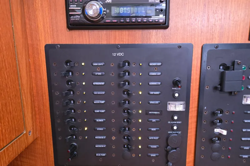 Slide: The Image of Electrical panel of a 2006 Hunter 36 sailboat with various switches and controls. - 20