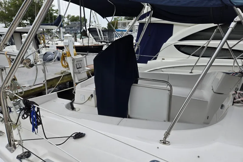 Slide: The Image of 2006 Hunter 36 sailboat docked at marina, featuring cockpit and rigging details. - 4