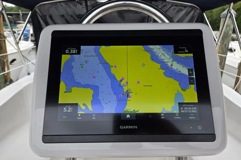 Slide: The Image of Garmin navigation display on a 2006 Hunter 36 sailboat, showing a detailed nautical map. - 41
