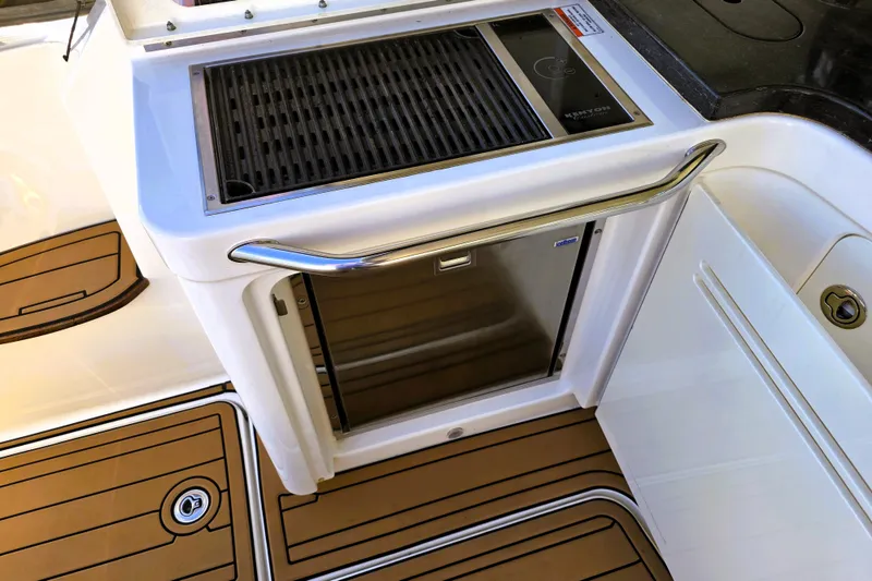Slide: The Image of Outdoor kitchen area on a 2012 Sea Ray 410 Sundancer yacht with grill and fridge. - 9