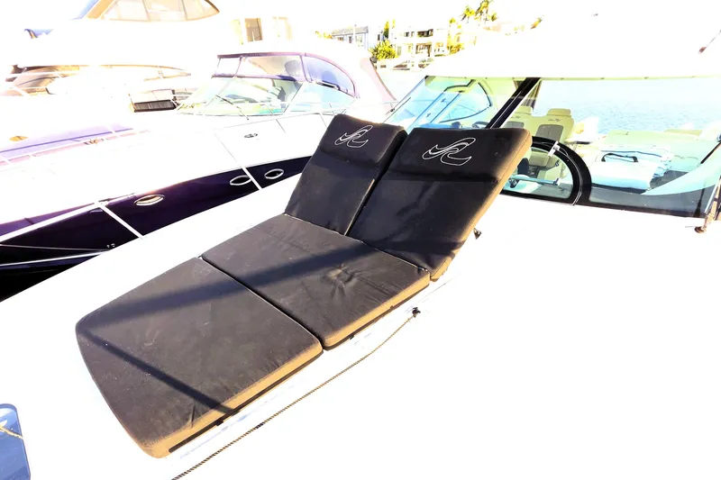 Slide: The Image of 2012 Sea Ray 410 Sundancer with black sun loungers on deck. - 39
