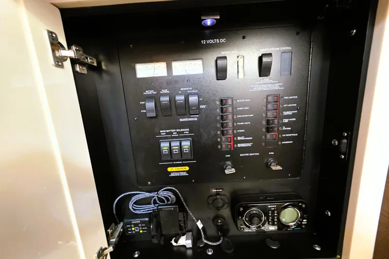 Slide: The Image of Electrical control panel inside a 2012 Sea Ray 410 Sundancer yacht. - 32