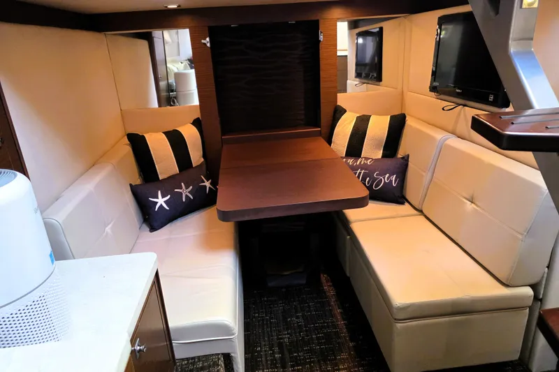 Slide: The Image of Luxurious interior of 2012 Sea Ray 410 Sundancer yacht with cozy seating and decor. - 21