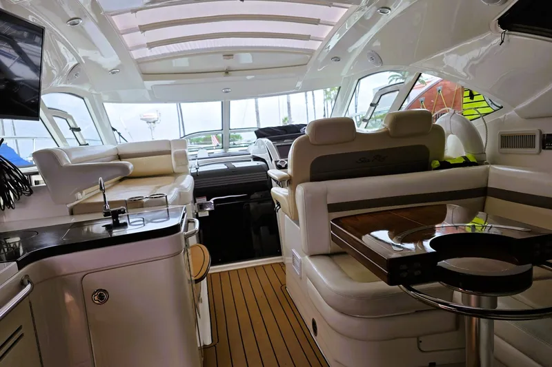 Slide: The Image of Luxurious interior of 2012 Sea Ray 410 Sundancer yacht with plush seating and modern amenities. - 3