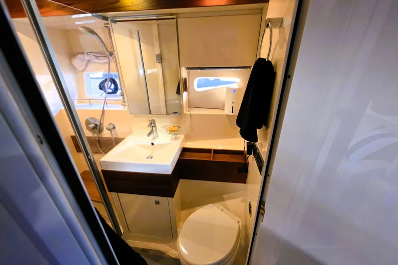 Slide: The Image of Luxurious bathroom in 2012 Sea Ray 410 Sundancer yacht with modern fixtures. - 28