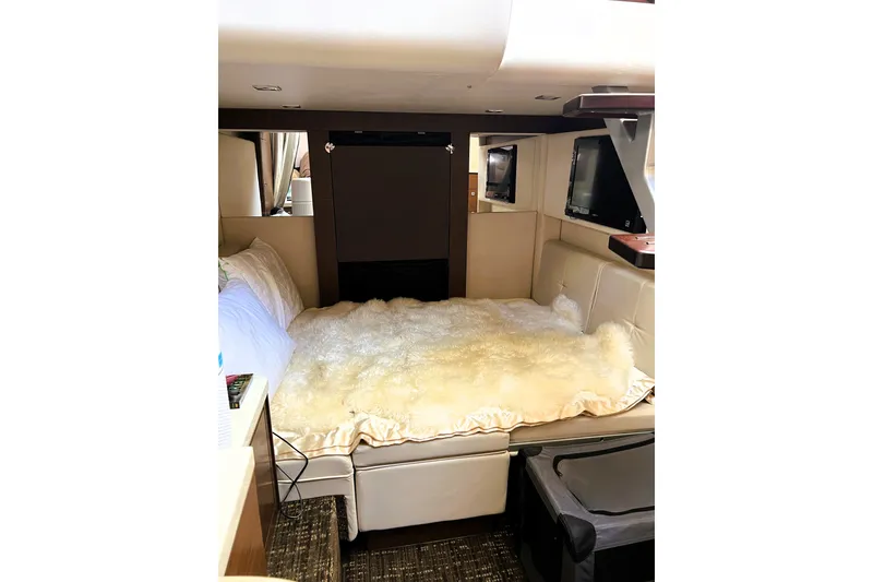 Slide: The Image of Luxurious interior cabin of 2012 Sea Ray 410 Sundancer yacht with cozy bedding. - 22