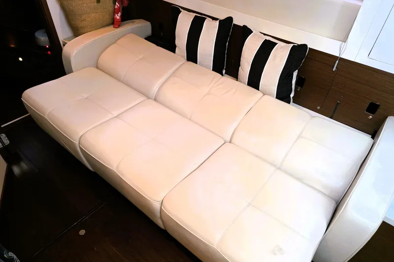 Slide: The Image of Luxurious white leather seating on 2012 Sea Ray 410 Sundancer yacht interior. - 24