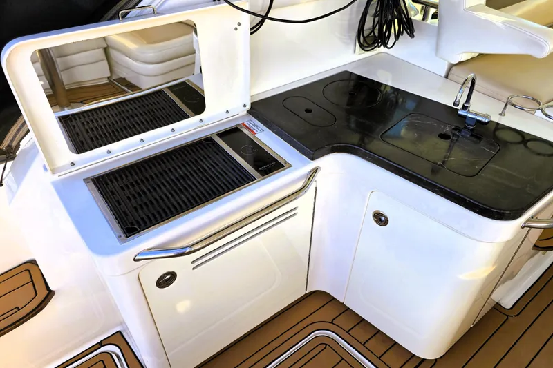 Slide: The Image of Outdoor kitchen on 2012 Sea Ray 410 Sundancer yacht with grill and sink. - 8