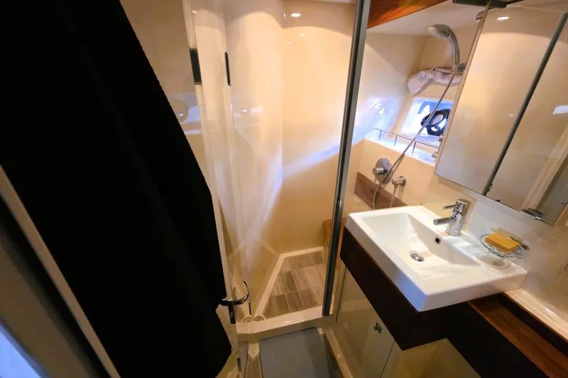Slide: The Image of Luxurious bathroom in 2012 Sea Ray 410 Sundancer yacht with modern fixtures. - 29