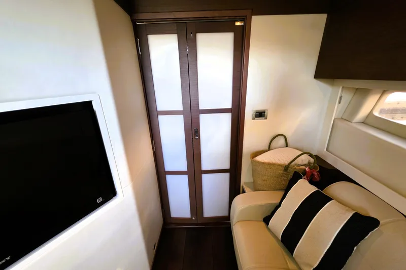 Slide: The Image of Interior of 2012 Sea Ray 410 Sundancer yacht with modern decor and comfortable seating. - 27