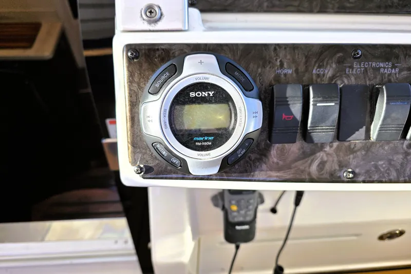 Slide: The Image of Sony marine audio system on 2012 Sea Ray 410 Sundancer control panel. - 14