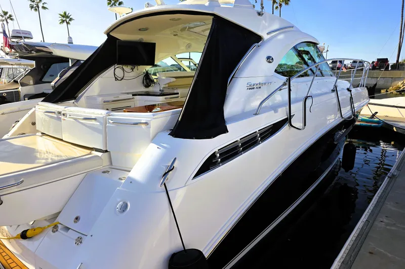 Slide: The Image of Luxury 2012 Sea Ray 410 Sundancer yacht docked at marina, sleek design. - 1
