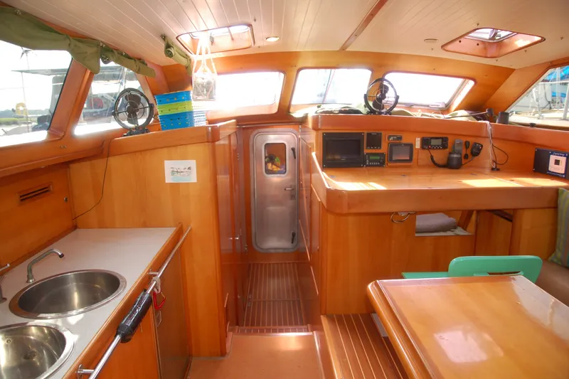 Slide: The Image of Interior of 2000 Garcia 48 Raised Salon yacht with wooden finishes and navigation equipment. - 61