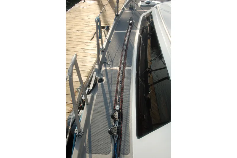 Slide: The Image of Deck view of 2000 Garcia 48 Raised Salon yacht, featuring rigging and dockside. - 12
