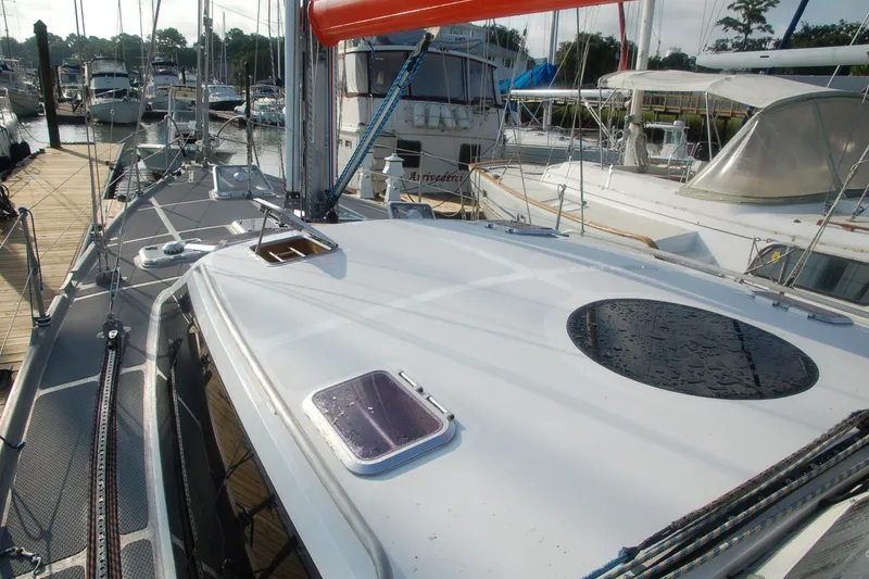 Slide: The Image of Sailboat Garcia 48 Raised Salon 2000 docked at marina with other boats. - 11
