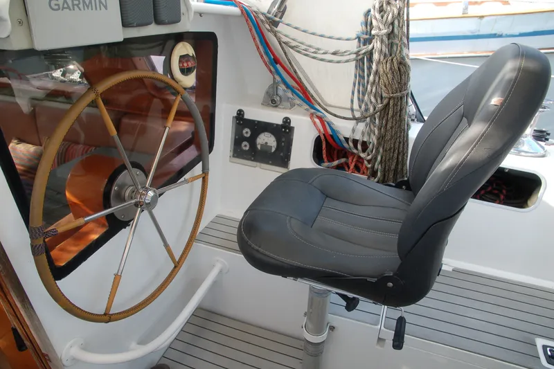Slide: The Image of Steering wheel and seat in 2000 Garcia 48 Raised Salon yacht cockpit. - 32