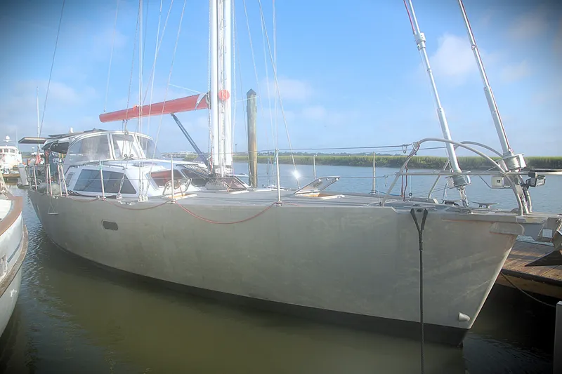 Slide: The Image of Sailing yacht Garcia 48 Raised Salon, 2000 model, docked in a serene marina. - 6