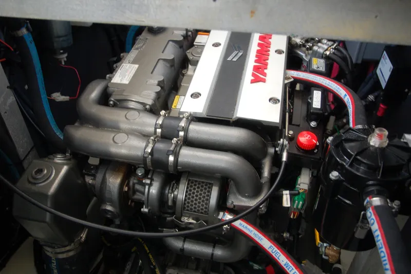 Slide: The Image of Engine compartment of a 2000 Garcia 48 Raised Salon yacht, featuring a Yanmar engine. - 41