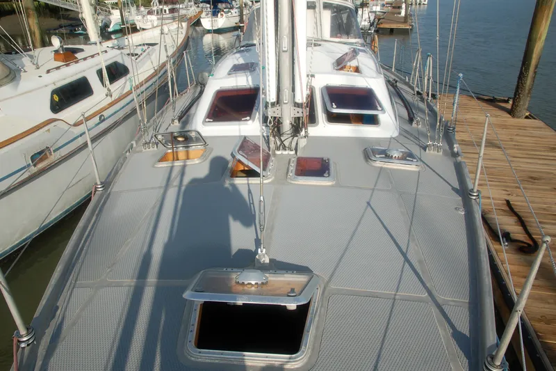 Slide: The Image of Deck view of 2000 Garcia 48 Raised Salon yacht docked at marina. - 16