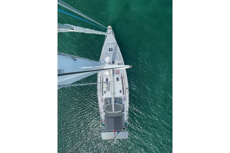 Slide: The Image of Aerial view of 2000 Garcia 48 Raised Salon yacht on green water. - 81